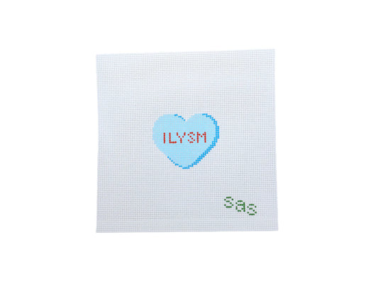 Cross-stitched heart with 'ILYSM' text on a white background