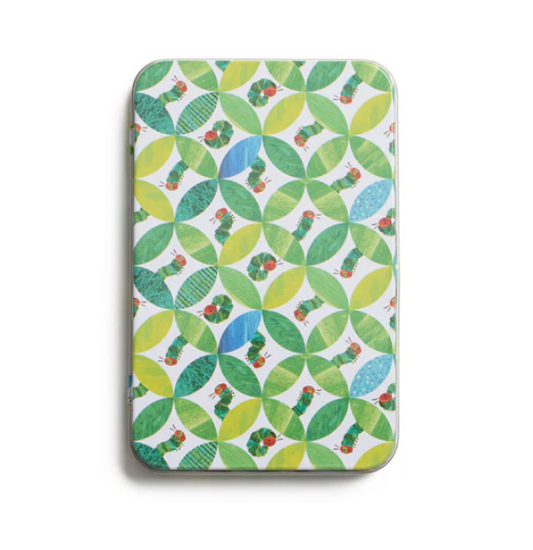 Patterned tin with green and blue design on a white background