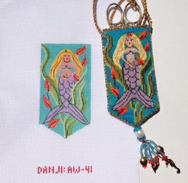 Mermaid-themed keychain with beadwork and decorative elements on a white background