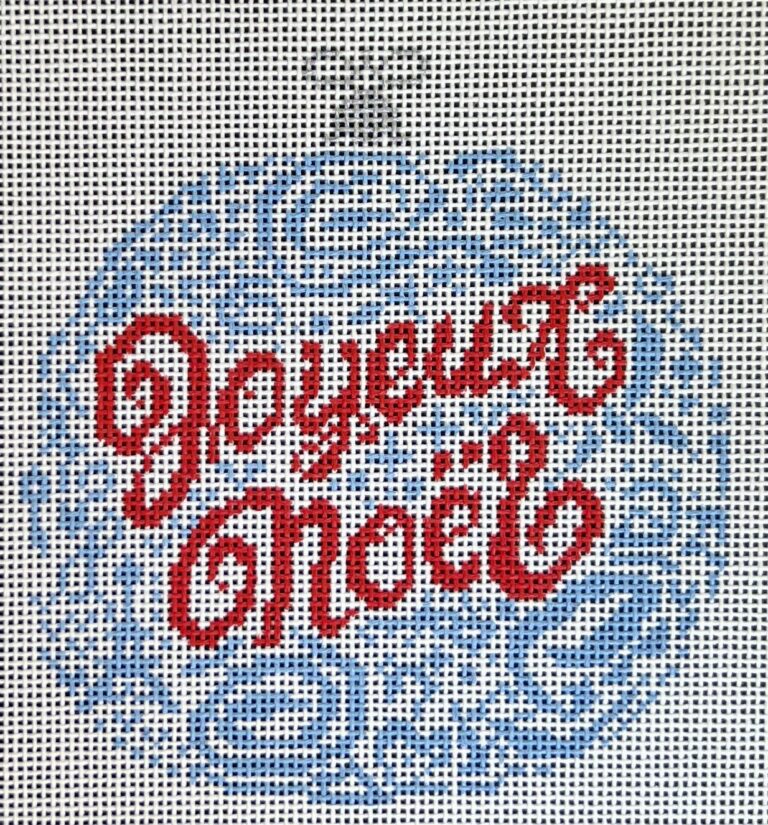 Cross-stitched design with 'Joyeux Noel' text on a white background