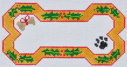 Cross-stitched design of a dog bone with a yellow border and green leaves on a white background