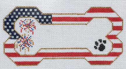 Decorative dog bone object with American flag design on a white background