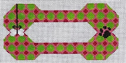 Dog bone-shaped toy with pink and green pattern on a white background
