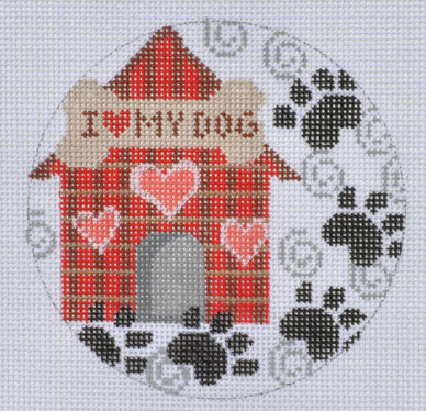 Cross-stitched design of a doghouse with 'I love my dog' text and paw prints.
