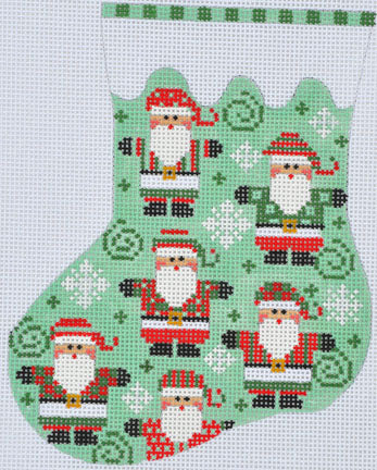 Cross-stitched design of a Christmas stocking with Santa Claus on a white background