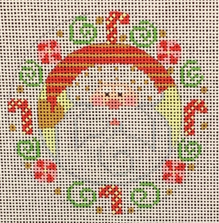 Cross-stitched design of a snowman with a red hat and scarf, surrounded by Christmas elements