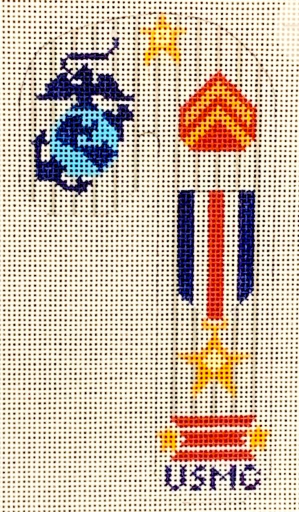 Decorative panel with military symbols and 'USMC' text on a white background