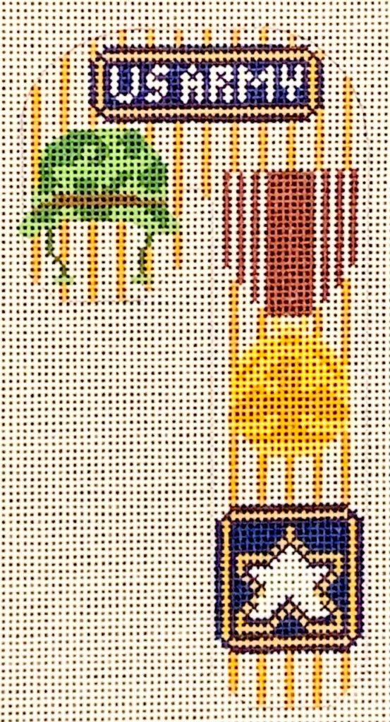 Decorative needlepoint with geometric patterns and a star design.