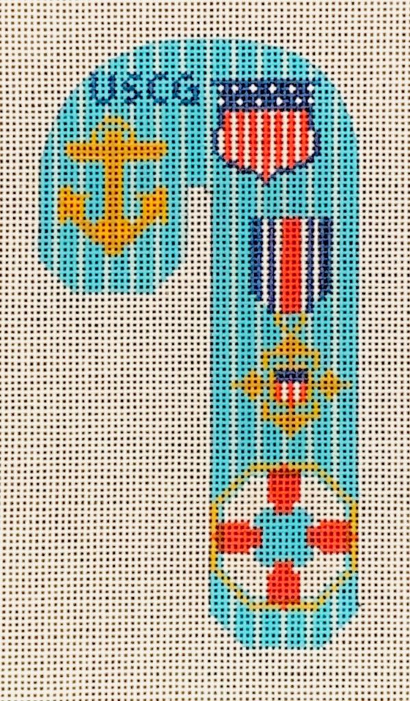 Decorative panel with USCG symbols including an anchor, flag, and life buoy on a blue background.