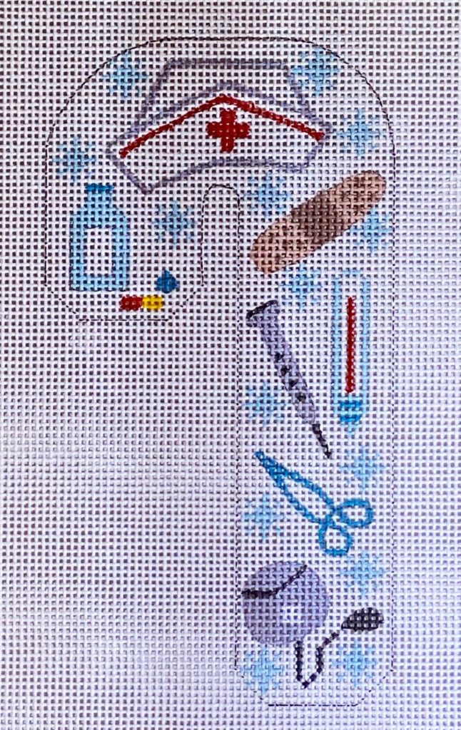 Cross-stitched design of a nurse's cap with medical symbols on a white background