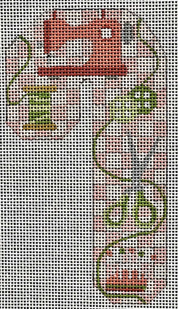 Cross-stitched pattern of a red sewing machine on a white background