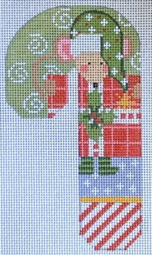 Cross-stitched design of a candy cane with a gingerbread man on a white background