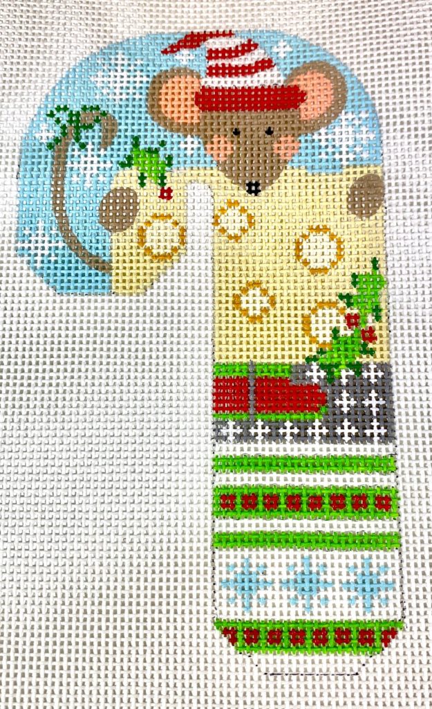 Decorative mouse in a Christmas-themed outfit with a blue background
