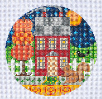 Circular needlepoint design of a house, tree, and animals on a white background