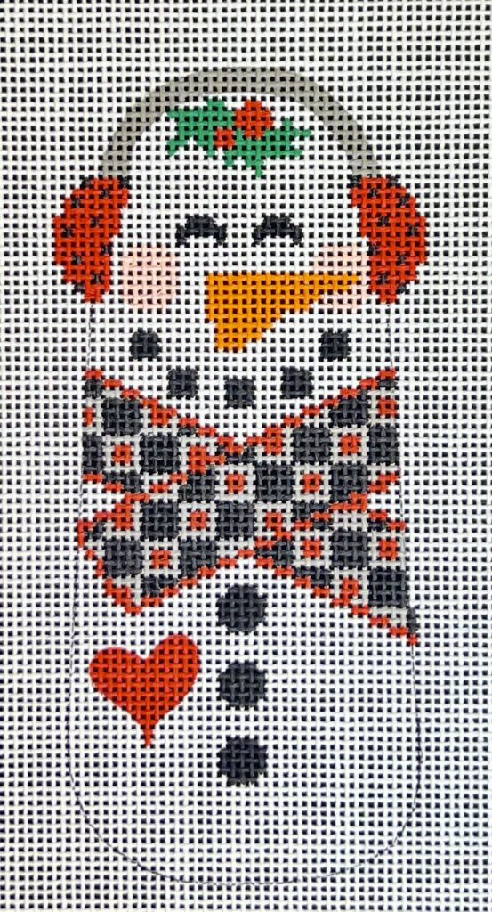 Cross-stitched design of a clown with checkered shirt on a fabric background