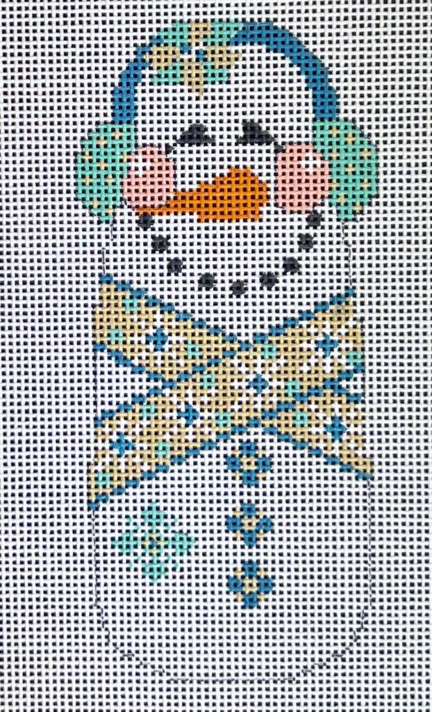 Cross-stitched snowman with a blue hat and scarf on a white background