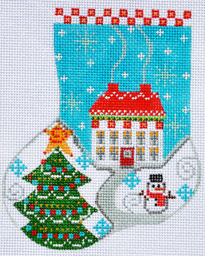 Cross-stitched design featuring a Christmas tree, house, and snowman on a blue background.