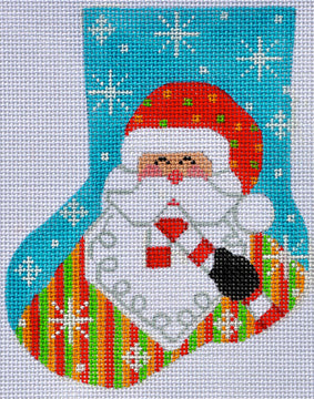 Cross-stitched design of a Santa Claus face in a colorful stocking with snowflakes