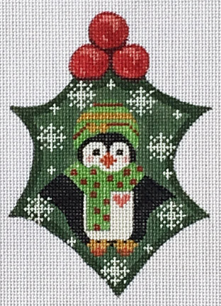 Cross-stitched penguin ornament with a green hat and red berries on a white background