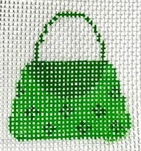 Green handbag with white polka dots on a white background