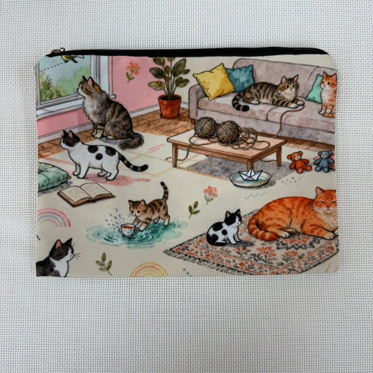 Pouch with cat-themed design featuring cats in a living room setting.