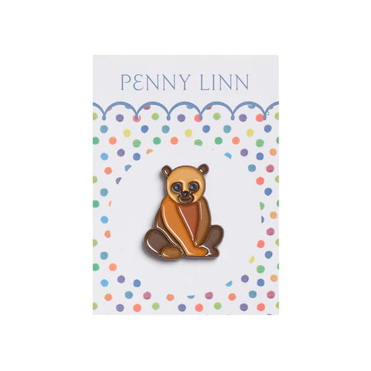 Polar bear pin on a colorful polka dot card with 'Penny Linn' branding