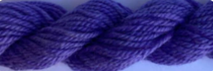 A close-up of thick twisted yarn in a medium-to-deep purple color.