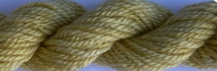 A close-up of a thick, twisted rope or cord in a pale yellowish-beige color.