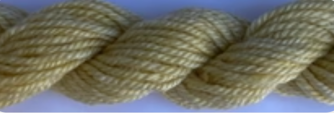 A close-up of a thick, twisted yellow fiber, likely wool yarn.