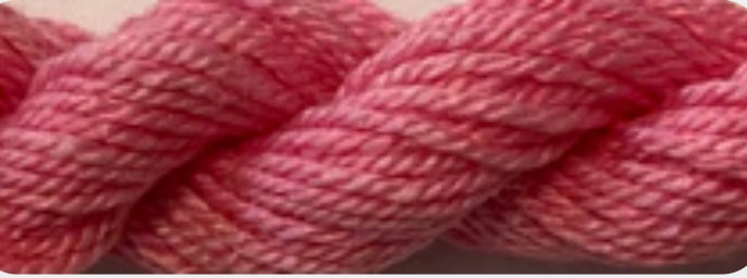 A close-up of a pink and white variegated yarn.