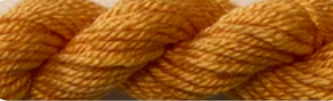 A close-up of a twisted skein of yarn in a warm mustard yellow color.