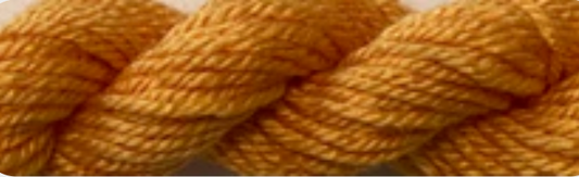 A close-up of a twisted skein of yarn in a warm mustard yellow color.